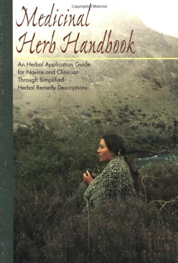 medicinal herb handbook book cover featuring woman in natural landscape holding herbs
